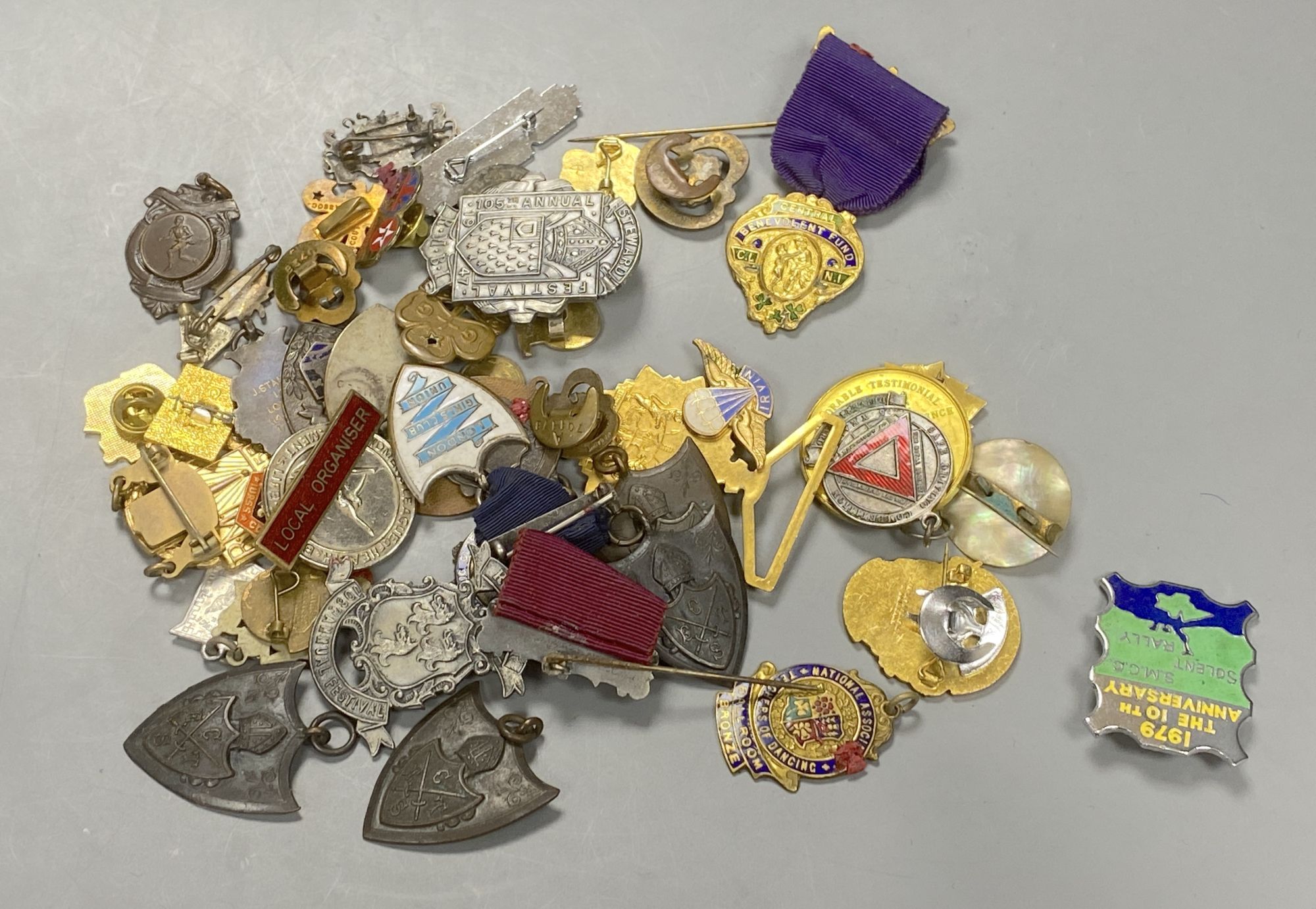 A group of mixed badges
